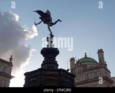 London, Greater London, England - May 04 2021: Statue of Anteros on The Shaftesbury Memorial Fountain often mistakenly called 'Eros' as a pigeon enjoy Stock Photo