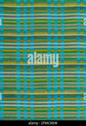 A flat area of woven fabric as a background texture and pattern in greens and blues Stock Photo