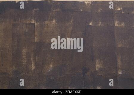 carelessly painted dark grey flat surface - texture and full frame background. Stock Photo