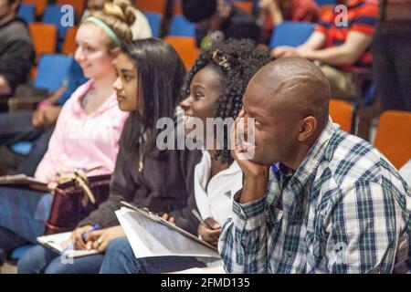 Students listening to a lecture in an auditorium Stock Photo
