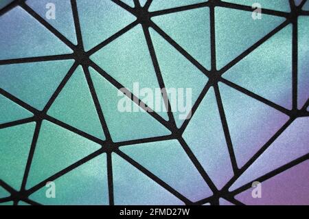 Rainbow-colored, shimmering, iridescent surfaces in a diamond-shaped division Stock Photo