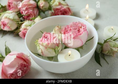 Romantic concept with roses and candles, close up Stock Photo