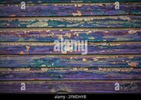 Old grunge colorful texture. Wooden board surface background with peeling paint. Stock Photo