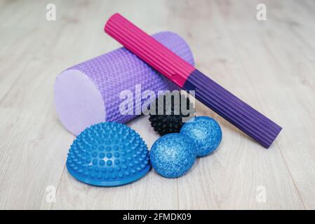 Massage tools used for trigger point therapy: spiky ball, foam roller, rubber roll, half balance rubber flat, full body massage tools Stock Photo