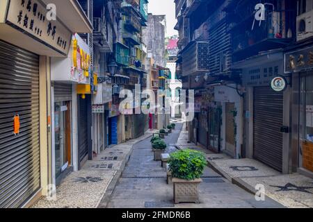 Macao, China - April 2, 2020: View to the urban street with short buildings at the sides in macao Stock Photo