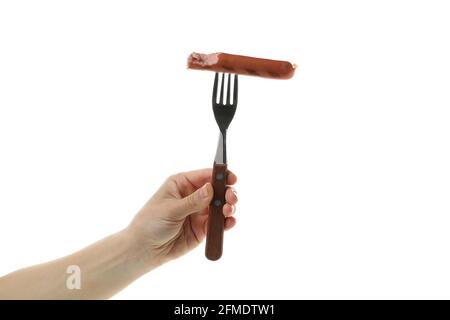 Female hand hold fork with grilled sausage, isolated on white background Stock Photo