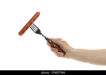 Female hand hold fork with grilled sausage, isolated on white background Stock Photo
