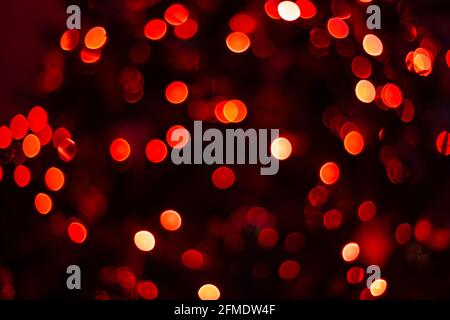 Various blurry red lights on black background. Stock Photo
