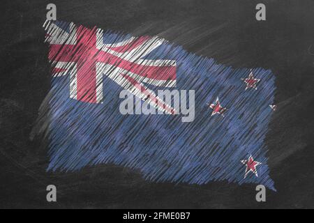 National flag of New Zealand hand drawn with chalk on blackboard. Flag waving in wind. One of a large series of flags of different countries. Educatio Stock Photo