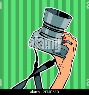 Female hand with a camera on a green background. Vector isolated illustration in pop art retro style. Stock Vector