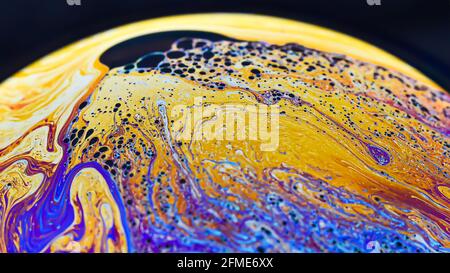 Beautiful psychedelic abstractions on the surface soap bubbles Stock Photo