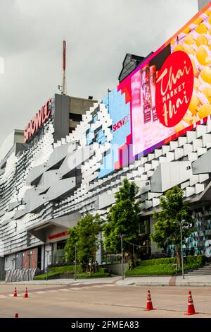 Huge colorful screens at the shopping center building in the metropolis of Bangkok in Thailand. Huai Khwang. Stock Photo