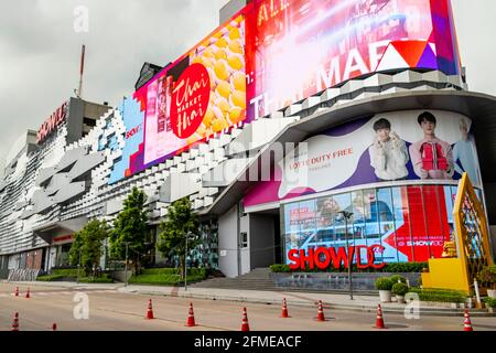 Huge colorful screens at the shopping center building in the metropolis of Bangkok in Thailand. Huai Khwang. Stock Photo