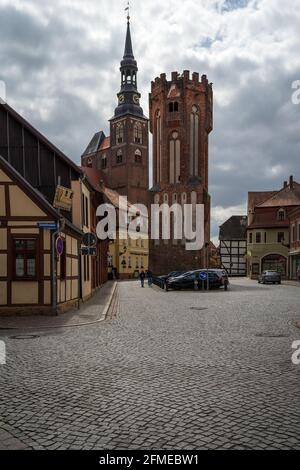 TANGERMUENDE, GERMANY - APRIL 24, 2021: Owl Tower and St. Stephen's Church in a historic town of Tangermuende. Saxony-Anhalt state. Stock Photo