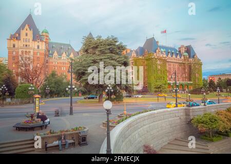 Victoria, B.C. Canada - June 12 2014:  Idyllic summer evening at the iconic chateauesque Fairmont Empress Hotel and Inner Harbour of Victoria, British Stock Photo