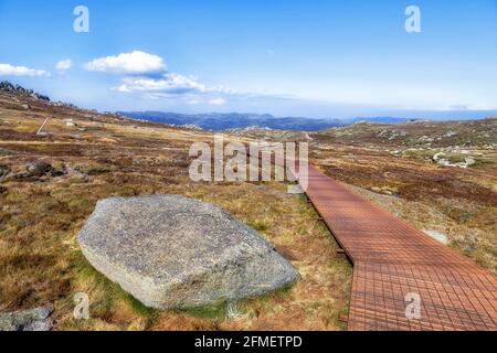 Steel boardwalk in Mt Kosciuszko national park of the Snowy Mountains in Australia - highalnds hiking to THredbo station. Stock Photo