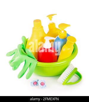 Cleaning items. Cleaning equipment rags, detergents, gloves, brushes, basket isolated on white background Stock Photo