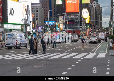 NEW YORK, NY - MAY 08: New York City Police Department (NYPD) officers are seen at a shooting site in Times Square on May 8, 2021 in New York City.  According to reports, a shooting that took place near West 44th St. and 7th Avenue in New York's bustling Times Square has injured two women and a four-year-old girl. Credit: Ron Adar/Alamy Live News