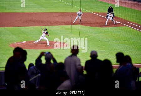 May 08, 2021: Atlanta Braves infielder Pablo Sandoval celebrates as he runs  down the first baseline after hitting a game tying home run during the  ninth inning of a MLB game against