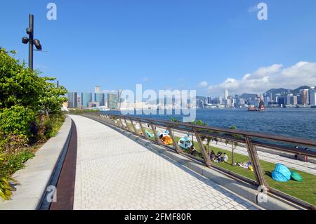 Harbourfront promenade along Victoria Harbour in the Art Park of West Kowloon Cultural District, Hong Kong Stock Photo