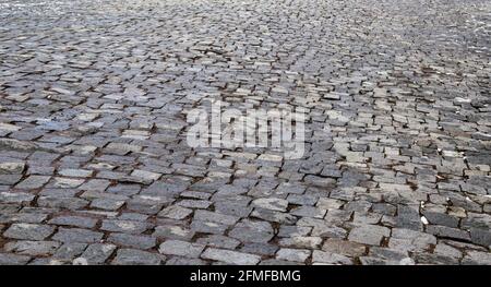 Paving stone coating in perspective. Old Stone Road Stock Photo