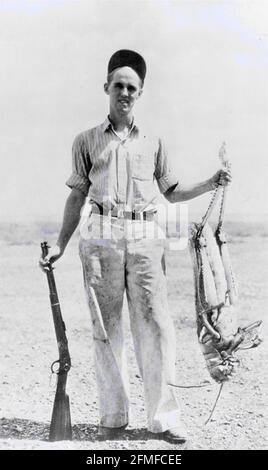 Bagged a beauty on the first day of the grasshopper hunting season. No wonder this huntsman is looking so happy. Recipes to follow. Yummy, yum, yum. Stock Photo
