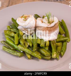 Recipe for steamed whiting fillets with tarragon, green beans and espelette pepper Stock Photo