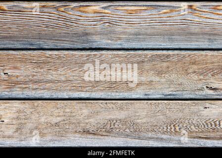 Three horizontal natural wooden panels in a light brown colour Stock Photo