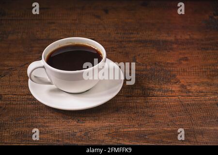 Coffee cup on a wooden table Stock Photo