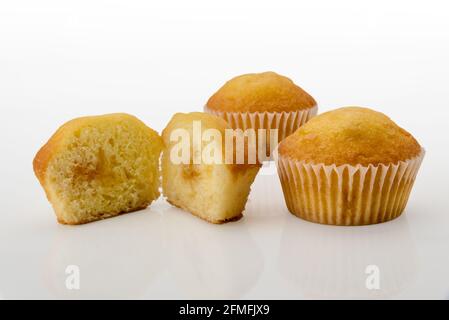 muffin cut with whole muffins isolated on white background Stock Photo