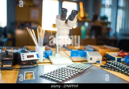 Modern microscope, Panel of LED light indicators is in the production Stock Photo