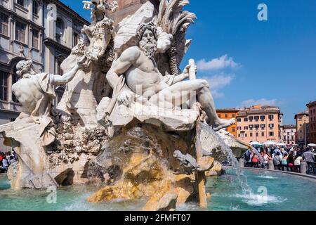 Rome, Italy.  Piazza Navona. Fontana dei Quattro Fiumi or Fountain of the Four Rivers created by Gian Lorenzo Bernini.  The historic centre of Rome is Stock Photo