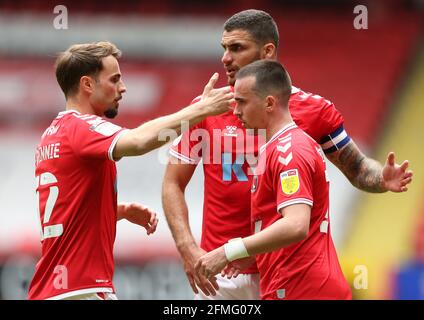Charlton Athletic's Liam Millar (right) is congratulated after his cross is turned in by Hull City's Jacob Greaves during the Sky Bet League One match at The Valley, London. Picture date: Sunday May 9, 2021. Stock Photo