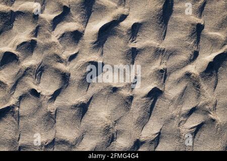 Natural sand sculptures on the beach. Stock Photo