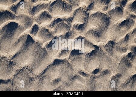 Natural sand sculptures on the beach. Stock Photo