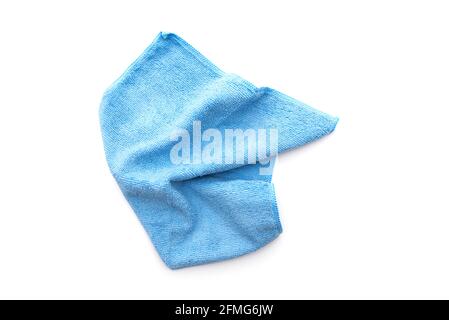 Blue kitchen rug isolated on white. Crumpled used micrifibre cloth clean, top view. Stock Photo