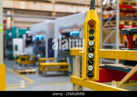 Remote control pendant switch for overhead crane in the factory Stock Photo