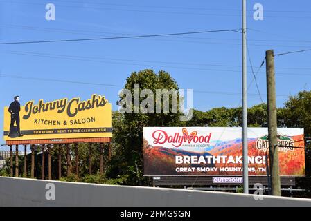 Nashville, TN, USA - September 22, 2019: Signs for country music stars Johnny Cash’s Kitchen and Saloon and Dolly Parton’s Dollywood. Stock Photo