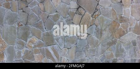 Natural stone wall textured background. Stock Photo