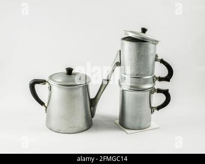 antique aluminum containers for the kitchen: a milk jug and a 'Neapolitan' coffee pot. Stock Photo