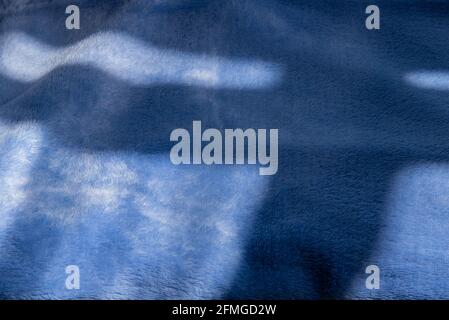 Fabric texture fleece blue with folds. Blue fleece fabric texture. Stock Photo