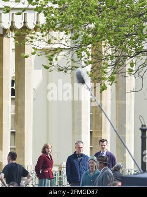 Brighton UK 9th May 2021 - Harry Styles and Emma Corrin filming a scene  from the movie 'My Policeman' by The Dome in Brighton today . The film  which is set in