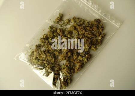 Marijuana - dried flower buds in a plastic bag. Stock Photo