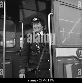 1960s, historical, a lady standing at the entrance to the London ...