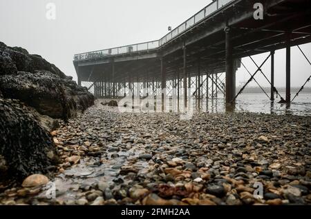 The Victorian pier in the fog at Herne Bay Kent UK Stock Photo