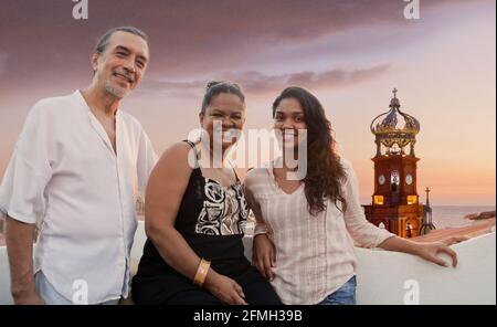 Family on upper level patio overlooking Our Lady of Guadalupe Church – Puerto Vallarta, on the west coast of Mexico. #613PV Stock Photo