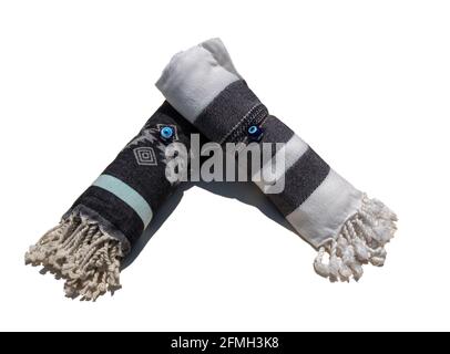 Two rolled Turkish towels isolated on white background Stock Photo