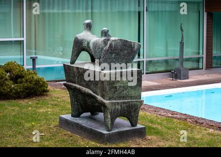 Reclining figure on pedestal (1960). A sculpture by Henry Moore in the garden of Didrichsen Art Museum in Kuusisaari district of Helsinki, Finland. Stock Photo
