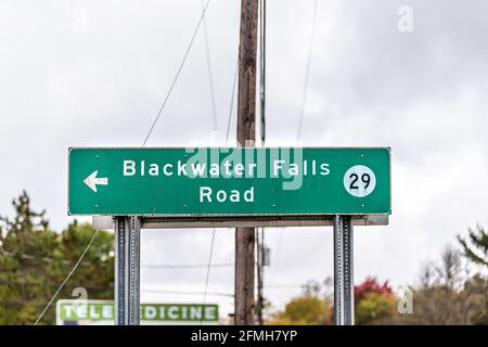 Davis, West Virginia and sign on road for Blackwater Falls 29 street in Canaan valley area with background text for telemedicine in USA fall season Stock Photo