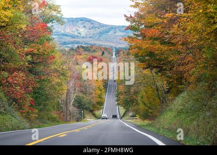 West Virginia road highway and many cars in traffic on autumn fall day near Blackwater Falls State park and Senca Rocks with steep hill Stock Photo